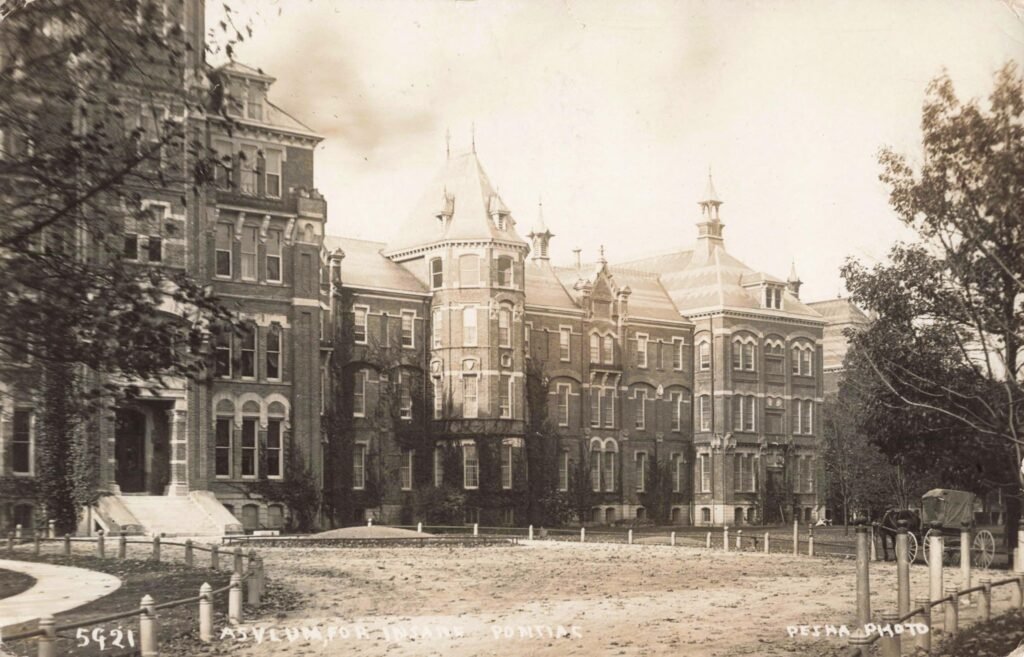 Historic asylum building with towers.