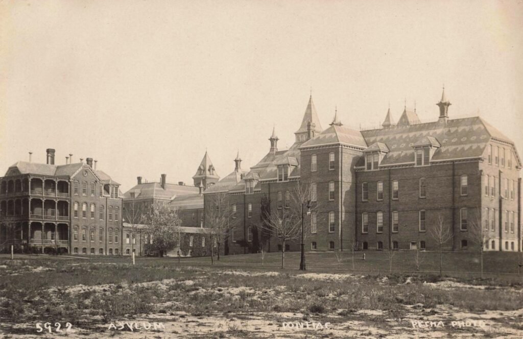 Historic asylum building with towers.