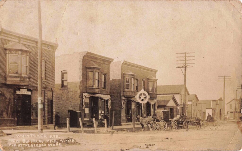 Historic street with horse-drawn carriages.