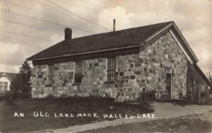 In the early 1900s, a small village 25 miles west of Detroit turned into a summer destination. People could hop on a Grand Trunk train or drive their new Ford to reach Walled Lake, the first beach west of the city. Walled Lake had quiet beginnings—just a few cabins, farms, and a one-room stone schoolhouse. But by 1919, the town buzzed with visitors. Detroit families packed picnics and set up along the shoreline. Entrepreneurs saw a chance to build bathhouses and dance halls to entertain them. The town’s Main Street came alive. Stores, diners, and ice cream shops served crowds every weekend. There were hotels, a bank, and even a meat market. But what pulled in the crowds was the lake and the music. By 1925, dance halls lit up the shoreline. One pavilion had a polished maple floor and hosted live jazz every night. Nearly a thousand people packed into these halls to swing and two-step under strings of lights. In 1928, Michigan’s first mirror ball spun from the ceiling, filling the room with flickers of light. Then came the roller coaster. In 1929, the Flying Dragon opened near the water, launching Walled Lake Amusement Park. That summer, families rode tilt-a-whirls, splashed in the lake, and took speedboat rides for fifteen cents. The fun didn’t stop at sundown. Dances kept going into the night. Bands broadcast on the radio. People came not just for rides and music, but to relax, meet others, and feel like part of something. The casino in Walled Lake wasn’t for gambling—it was a dance hall. A place where farmers, city folks, and teenagers shared one floor. Even during the Great Depression, the music played on. On the corner of Main and Liberty, visitors could pump water by hand and rest at the Pioneer Inn, a landmark that once hosted traveling performers and church socials. Nearby, the Stonecrest school stood as a reminder that Walled Lake wasn’t just a resort—it was still a hometown. Teachers like Joseph Moore taught generations who grew up swimming in the same waters tourists paid to see. This was Walled Lake’s golden age. A lakeside town that became a summer tradition. The sound of laughter, the smell of hot dogs, and the rhythm of big-band music filled the air. And through it all, the quiet lake remained—hiding the glacial rock wall beneath the surface that gave the town its name. Thanks for watching, please follow us for future episodes.
