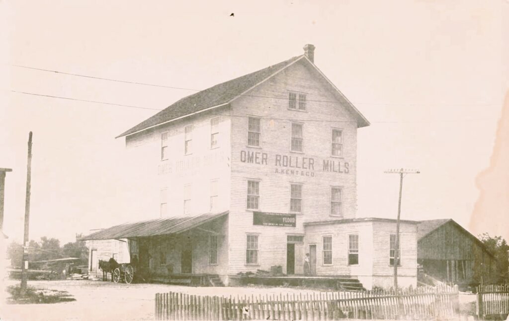 Historic roller mill building, vintage photo.