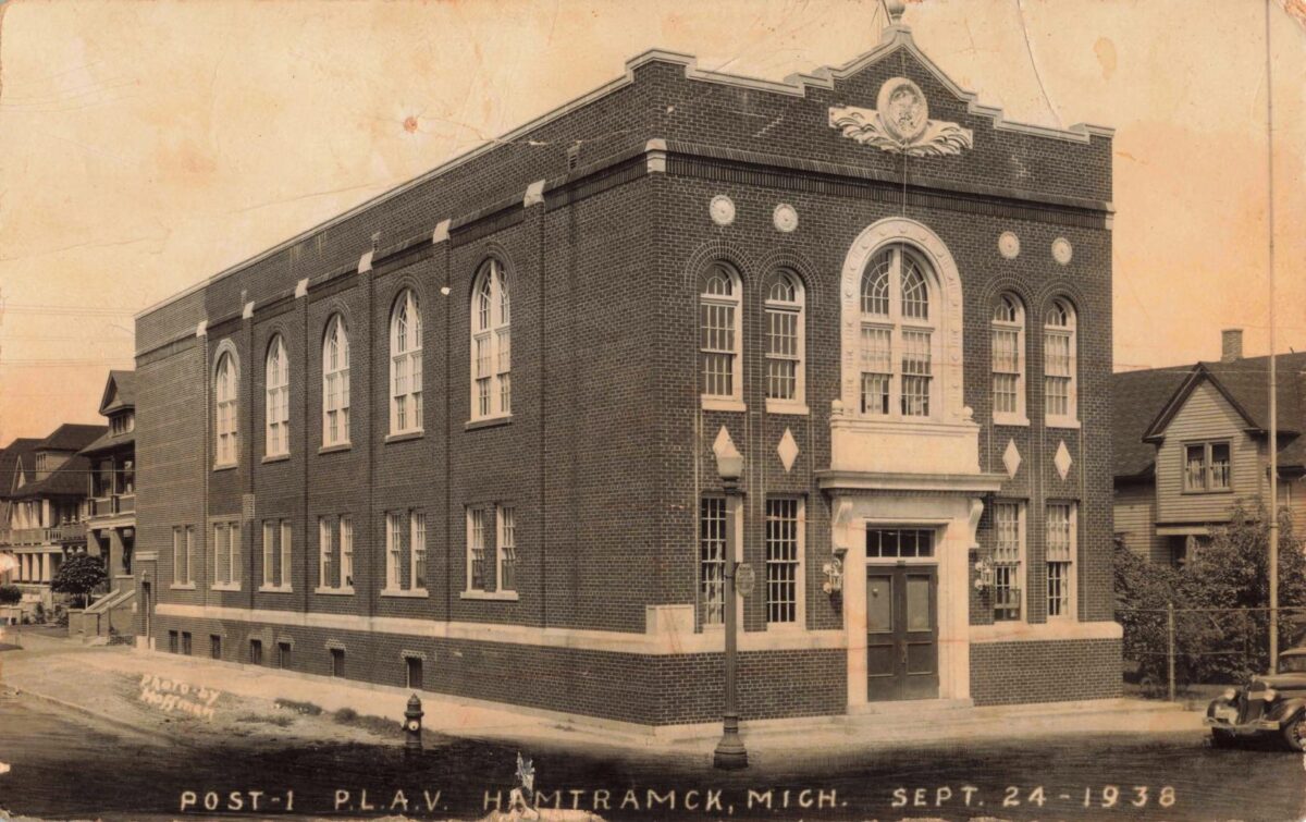 Sepia-toned postcard image of a two-story brick hall with arched windows on a street corner, labeled “Post-1 P.L.A.V. Hamtramck, Mich. Sept. 24-1938.