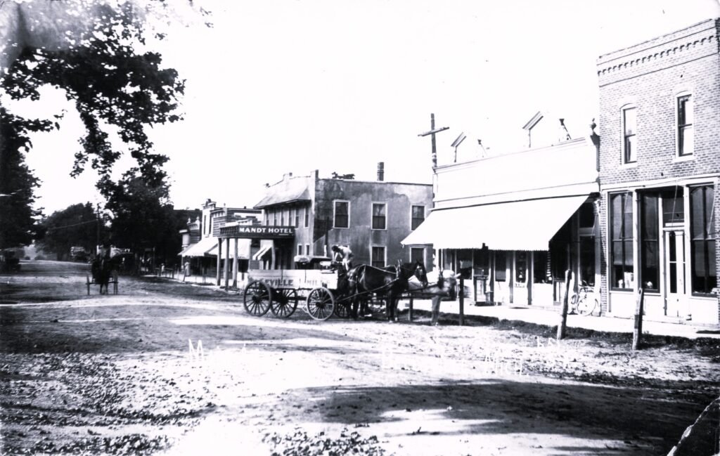 Main Street, Belleville, Michigan, showing the Mandt Hotel and commercial storefronts.