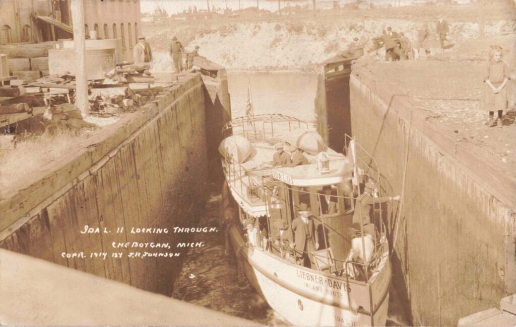 Historic boat passing through lock