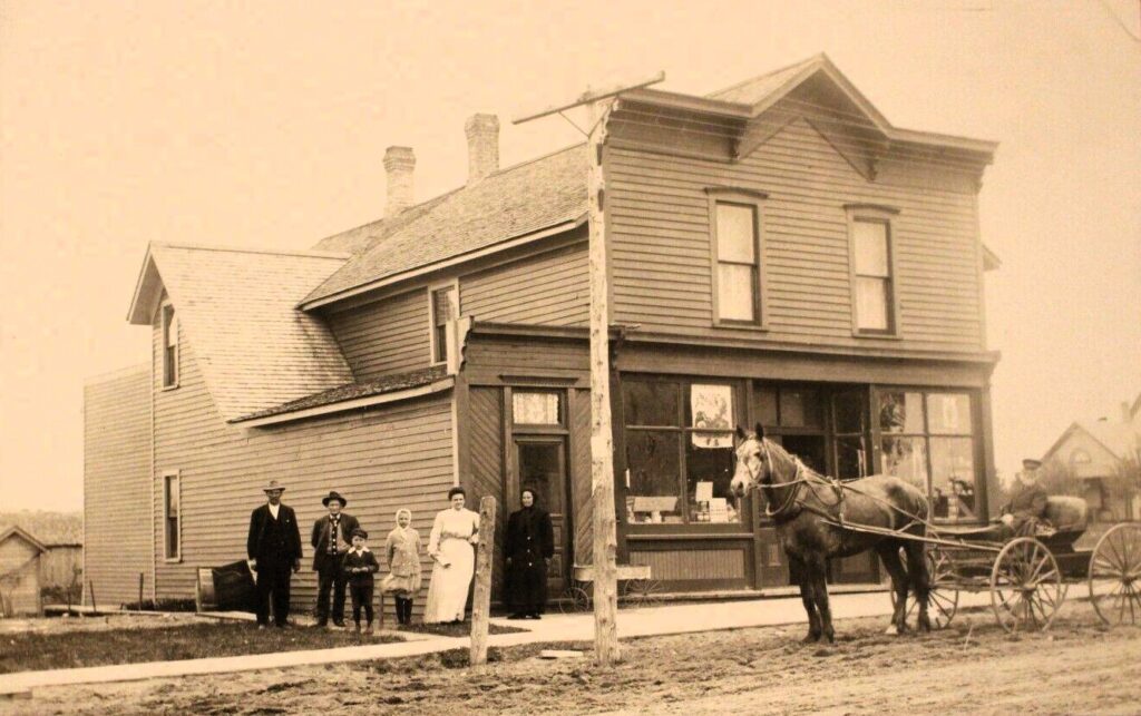 Horse and buggy parked in front of a Copemish storefront, early 1900s.