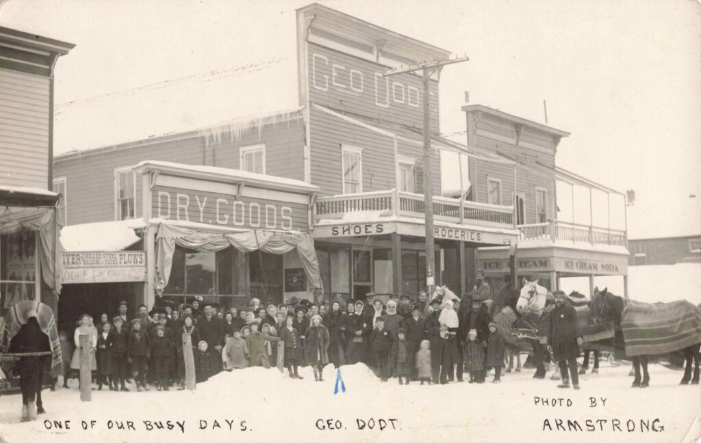 “One of Our Busy Days” postcard showing downtown activity in Copemish.