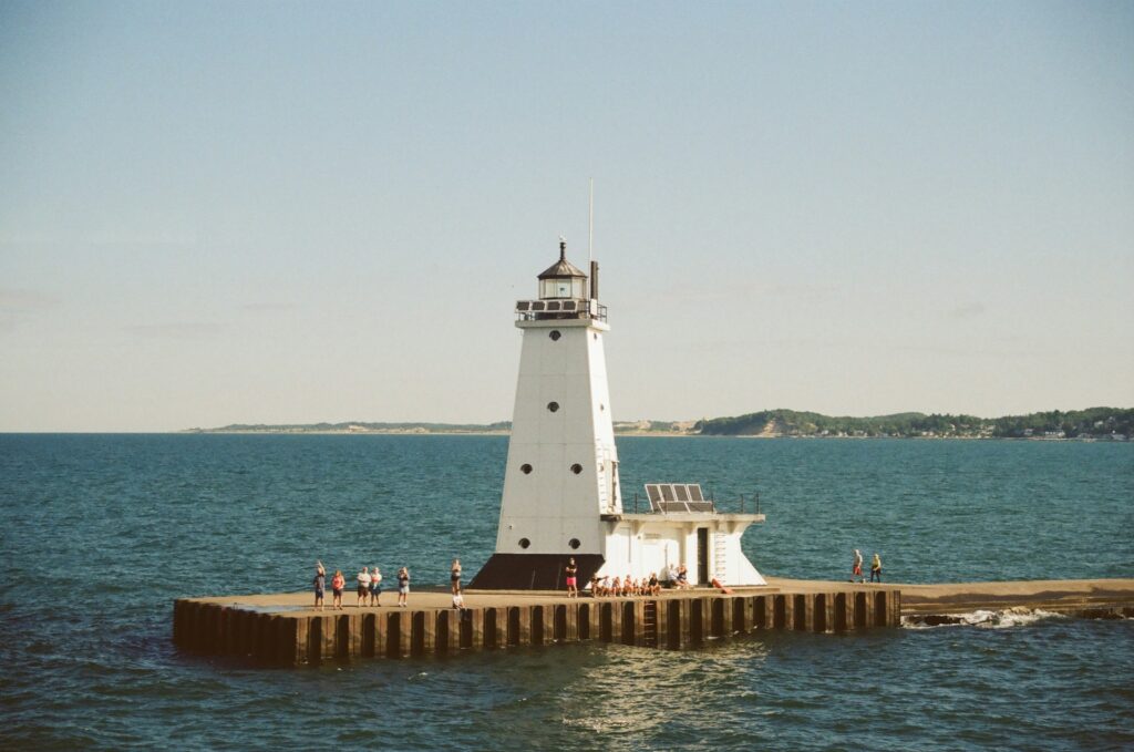 Lighthouse on pier by the sea