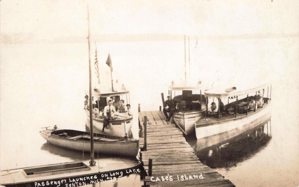  Passenger launches at Case’s Island
A lake-traffic view showing excursion-style movement between shore, island, and open water.