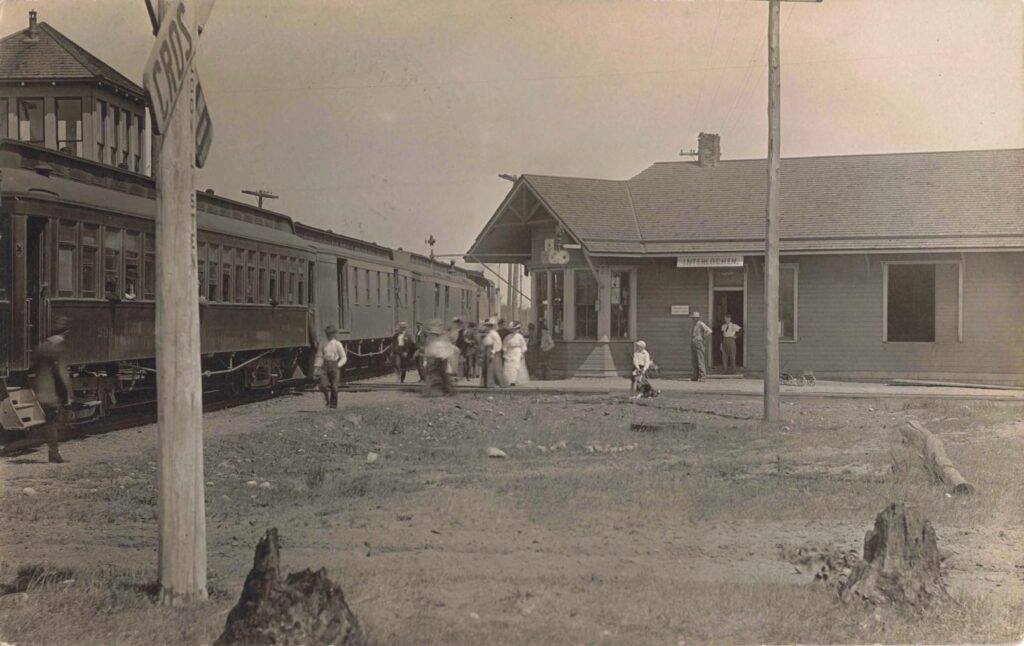 History of Interlochen MIchigan - The depot, a small but vital stop where rail travel fed the local economy and later brought summer visitors. (David V. Tinder Collection, University of Michigan Library Digital Collections.) 