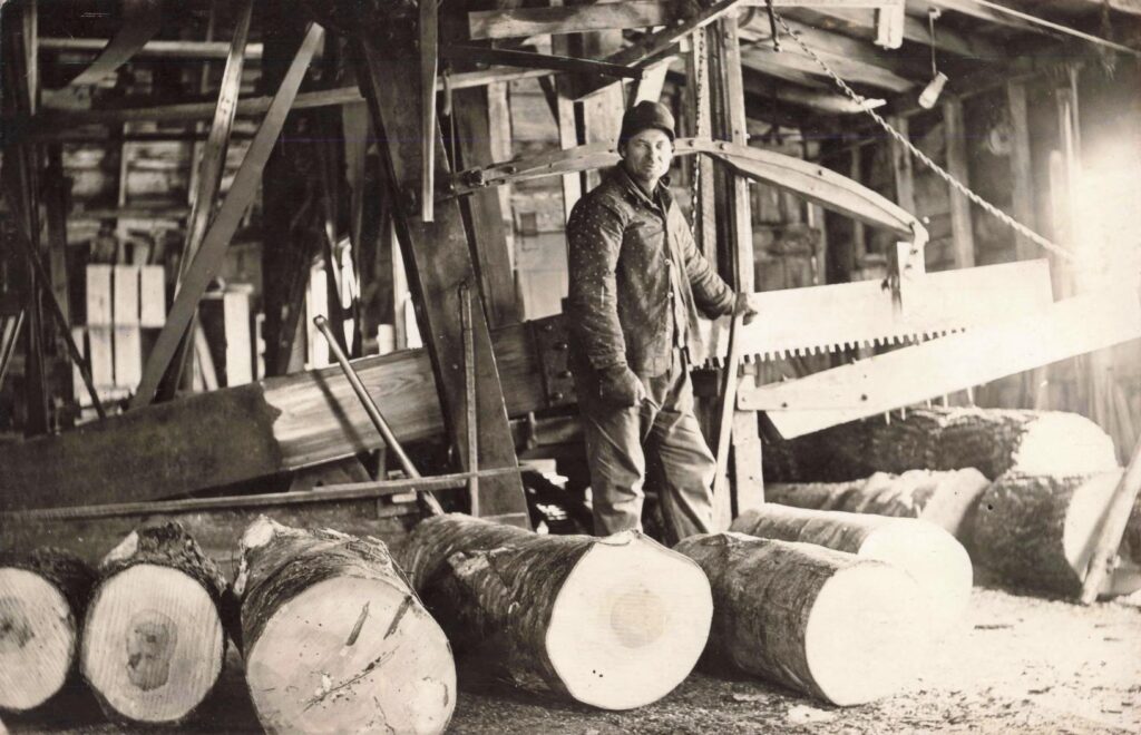 Inside a Copemish mill setting—postcards document wood processing as an everyday industry, not an occasional activity.