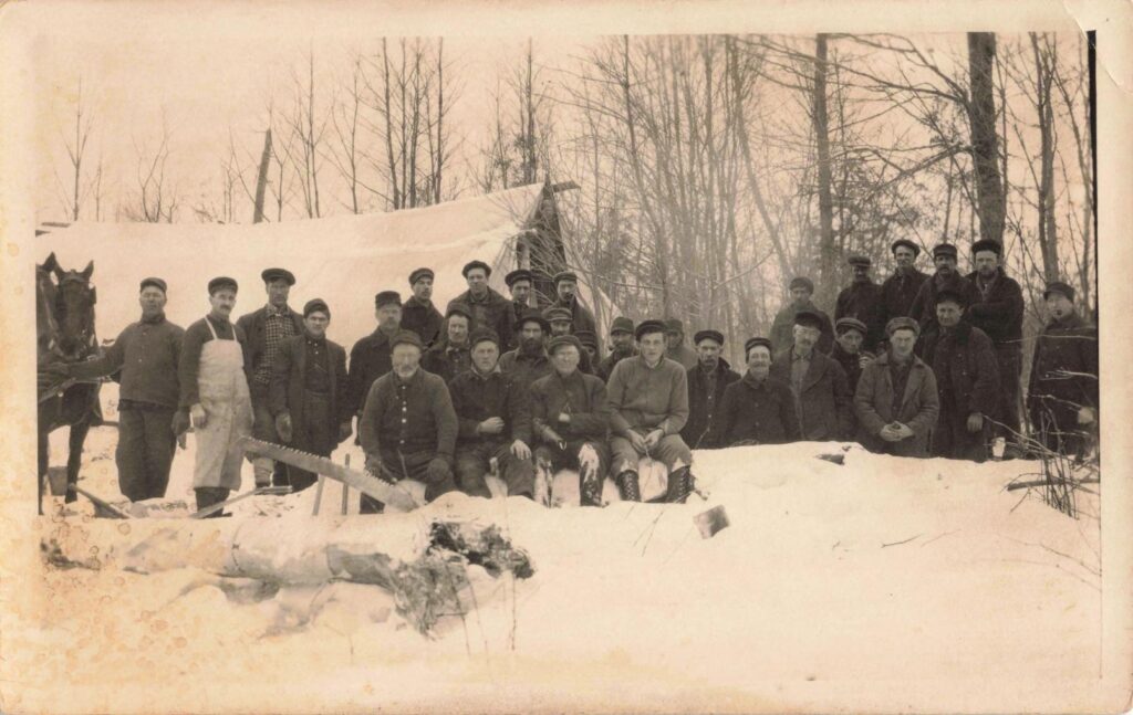 Group of men in snowy landscape.