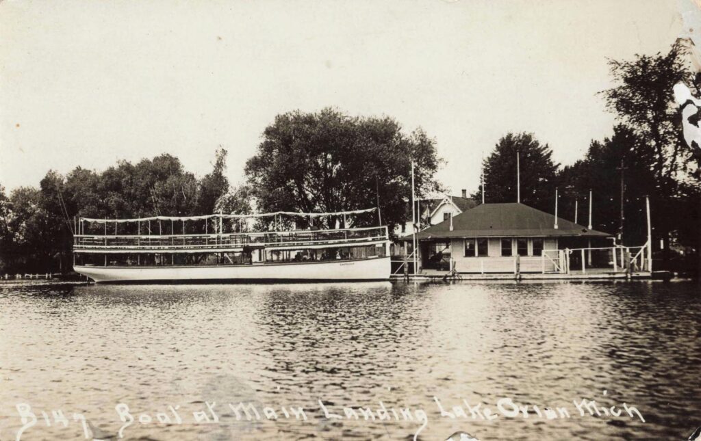Boat docked at lakeside landing.