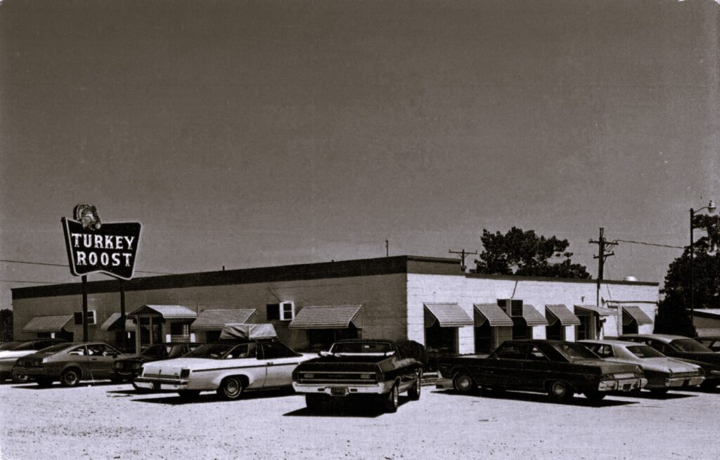 The Turkey Roost roadside restaurant, a mid-20th century stop for travelers, reflecting the shift from rail and farm traffic to automobile tourism.