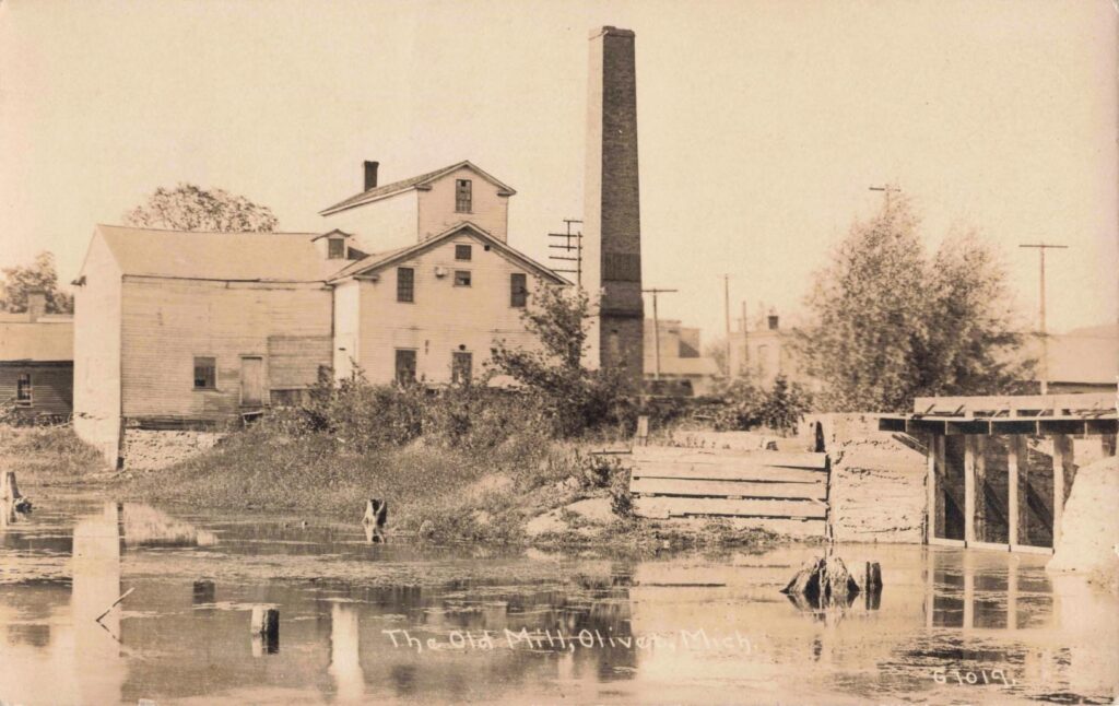 Historic mill by a calm river.