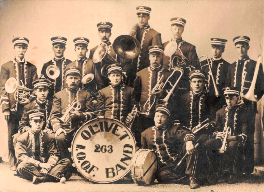 Vintage band posing with instruments.