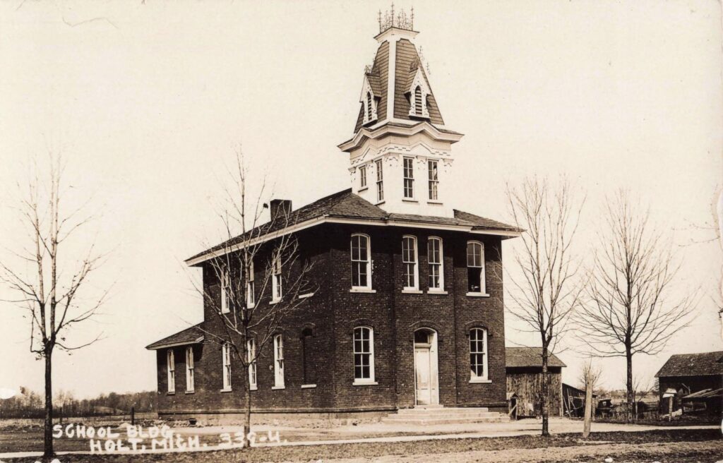 Historic brick school building with tower