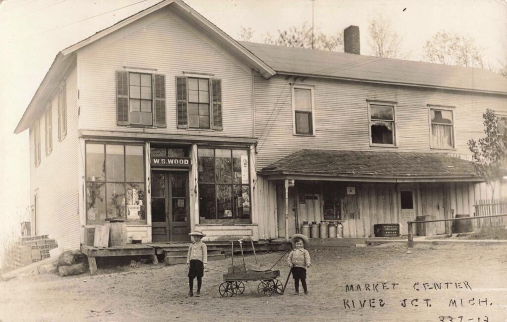 Historic store with children outside.
