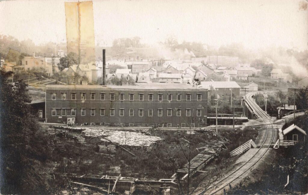 Elevated town view with rail line and factories