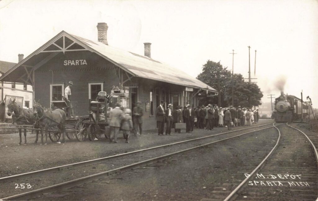 Sparta depot with crowd and steam locomotive - Sparta Michigan History