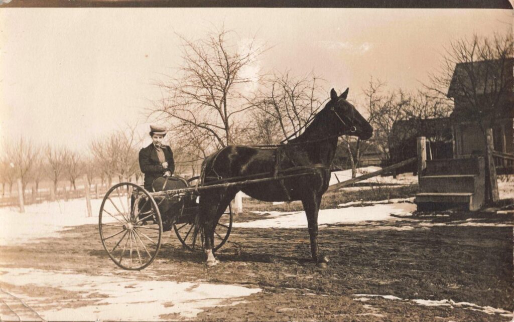 Rows of young orchard trees and farm buildings show the shift from lumbering to agriculture as the dominant way of life in Kawkawlin by the early 20th century.