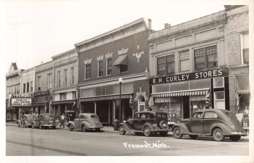 Historic street with vintage cars.