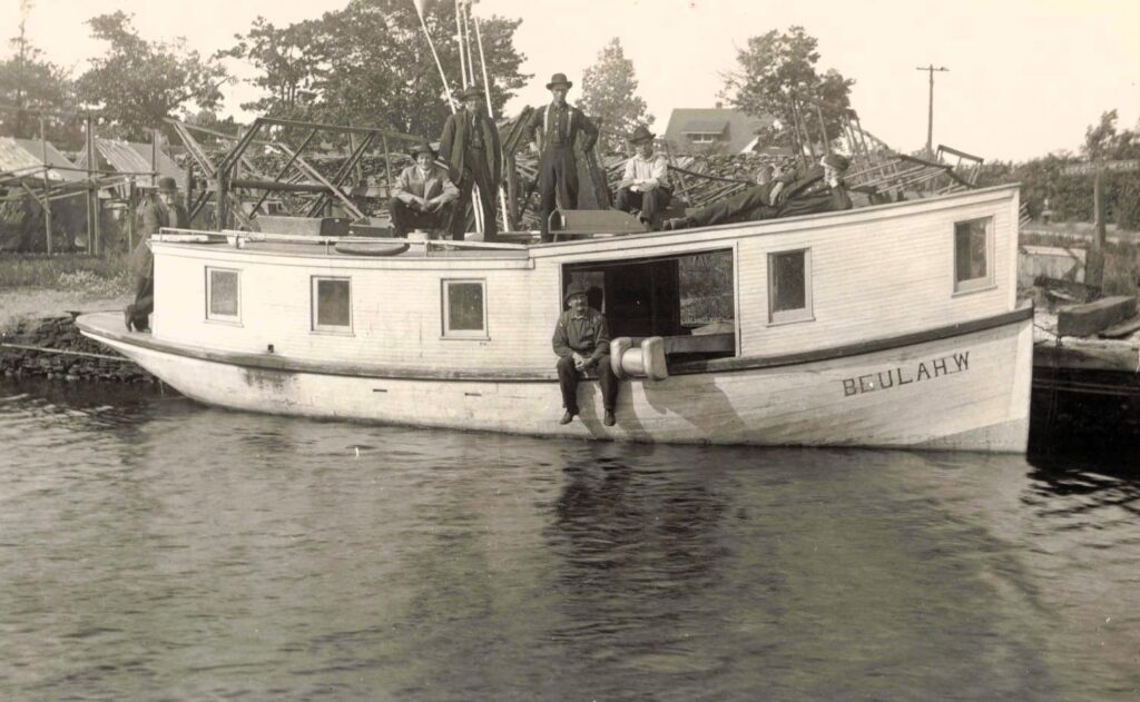 Historic fishing tug with crew