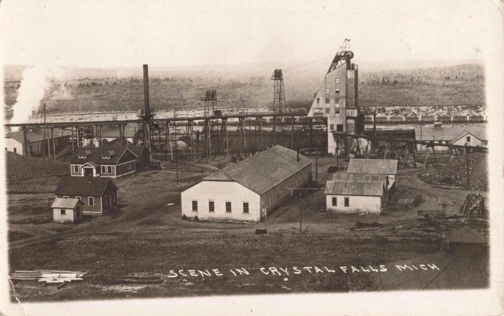 Historic industrial scene with buildings.