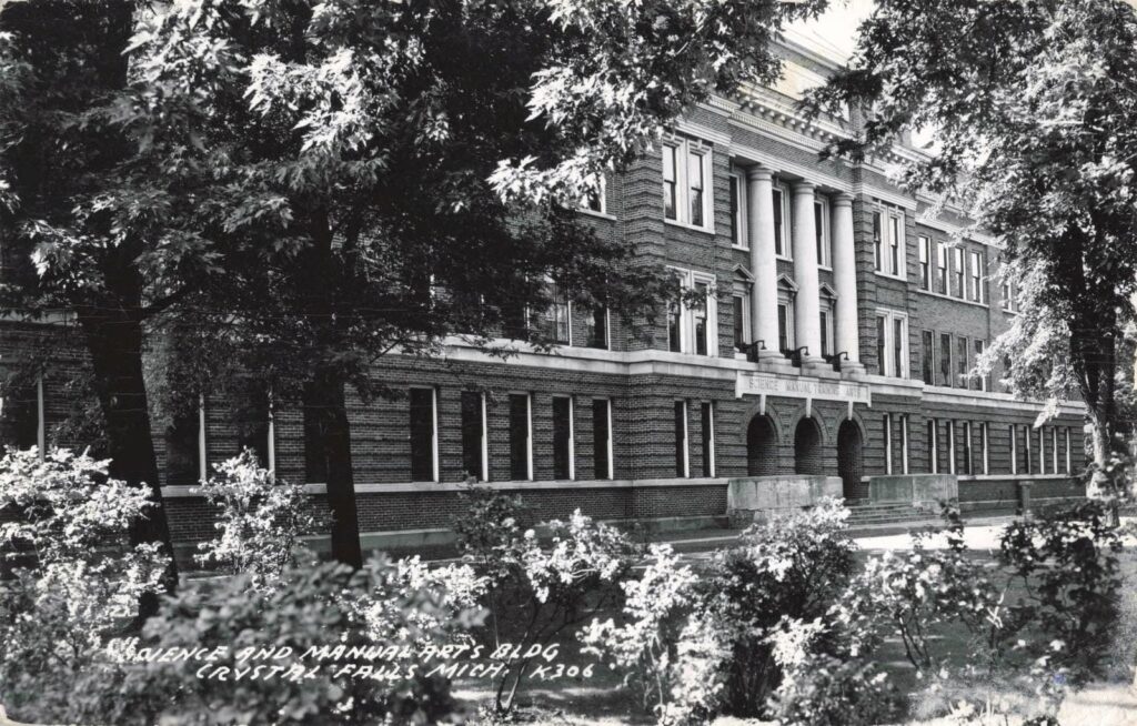 Historic brick building surrounded by trees.
