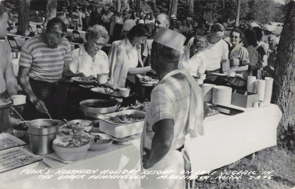 Guests being served food outdoors at Funk’s Northern Holiday Resort on Lake Gogebic.