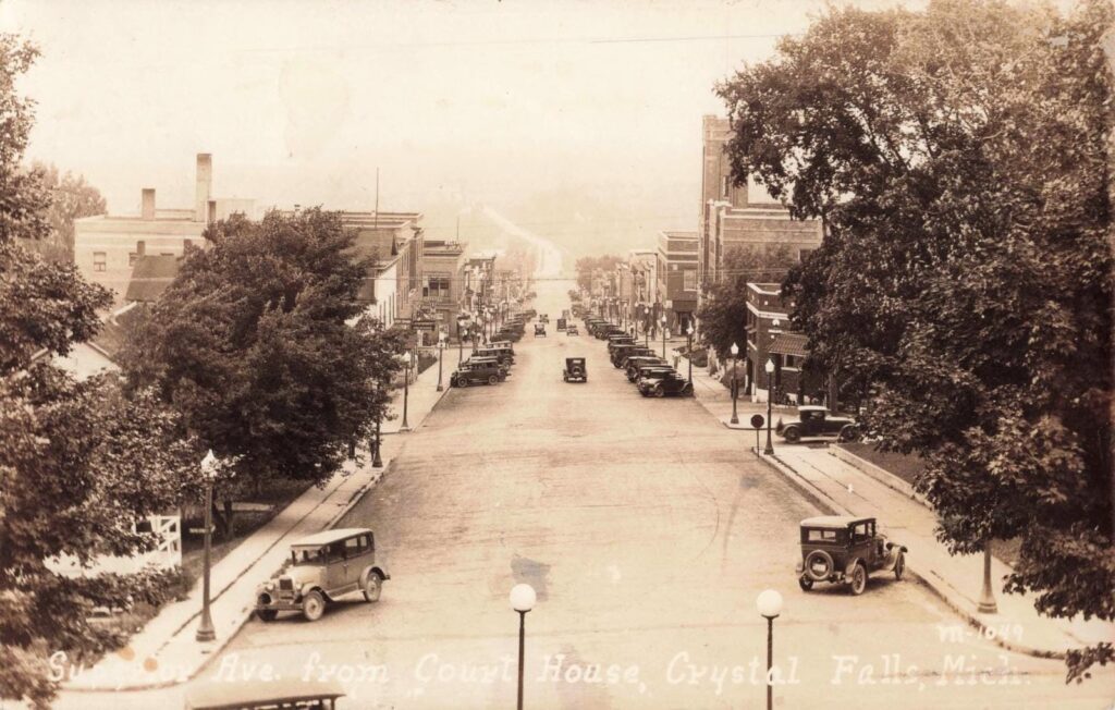 Historic street view with vintage cars