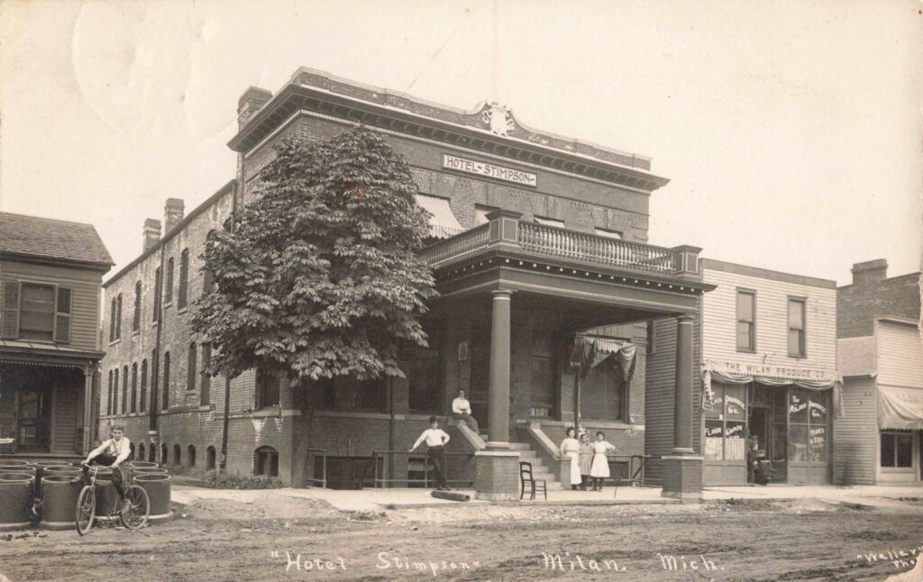 Historic hotel with people outside.