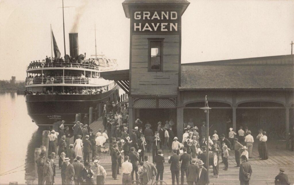 Historic dock with steamboat and crowd