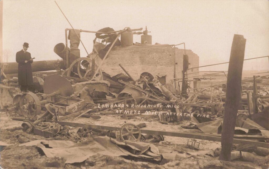 Mill ruins in Metz after the fire, showing industrial wreckage and burned machinery.