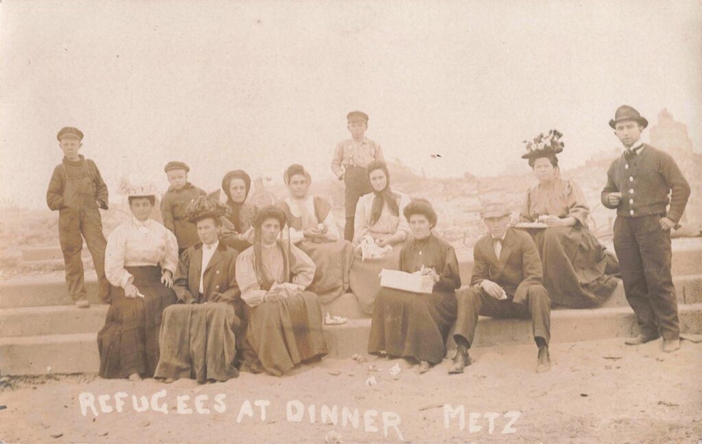  Refugees at dinner in Metz after the fire, showing residents in the days after the disaster.