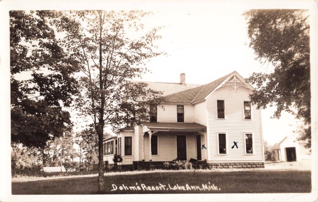 Dohm’s Resort in Lake Ann, showing a large resort house set among mature trees.