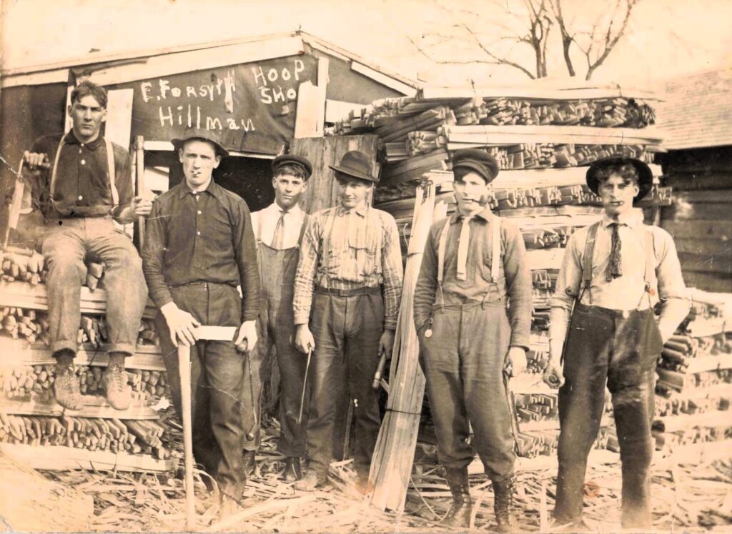 Six men outside a hoop shop.