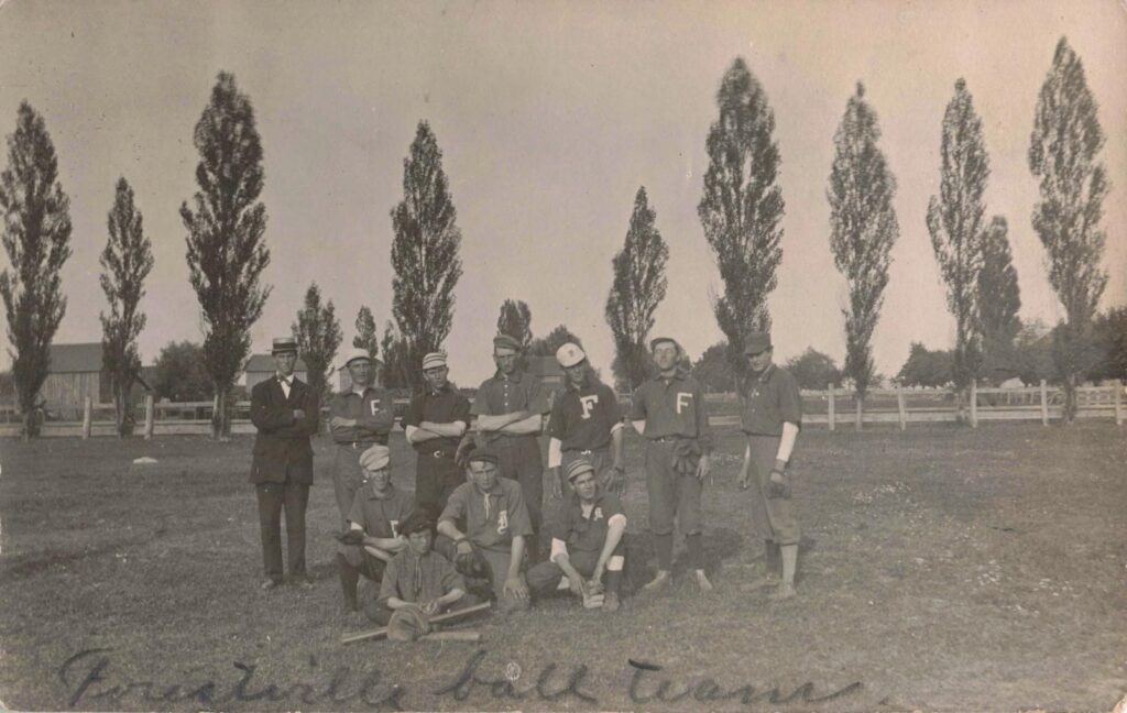 Vintage baseball team in a field.