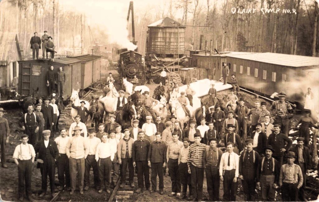 O’Lairy Camp No. 2 shows the labor force, horses, rail cars, and camp structures that sustained Sigma.