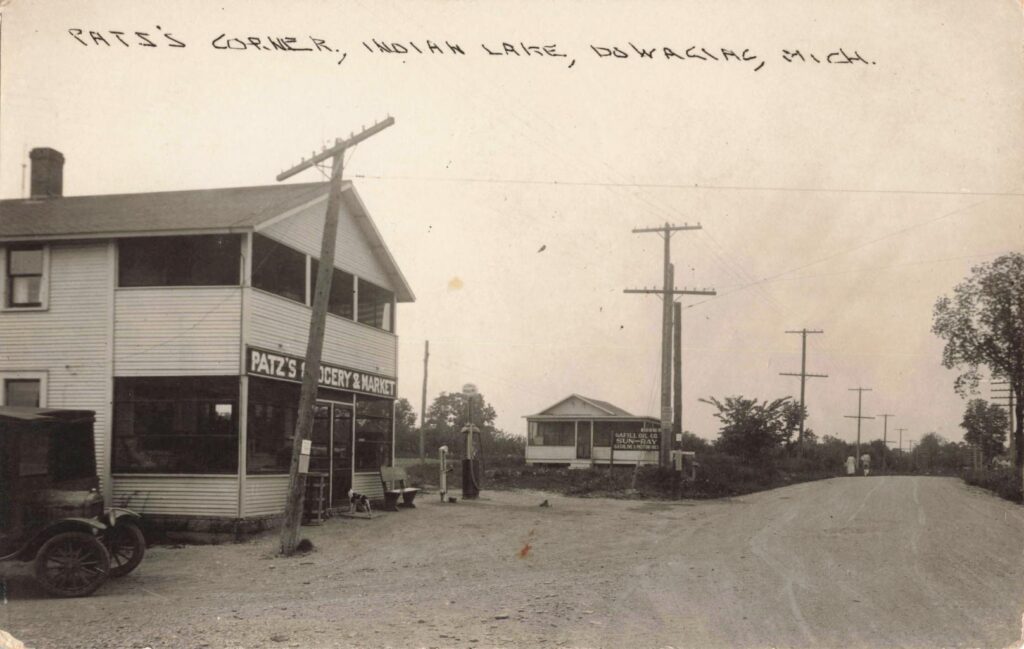 atz’s Corner shows the automobile age arriving at Indian Lake, with groceries, gasoline and roadside service.