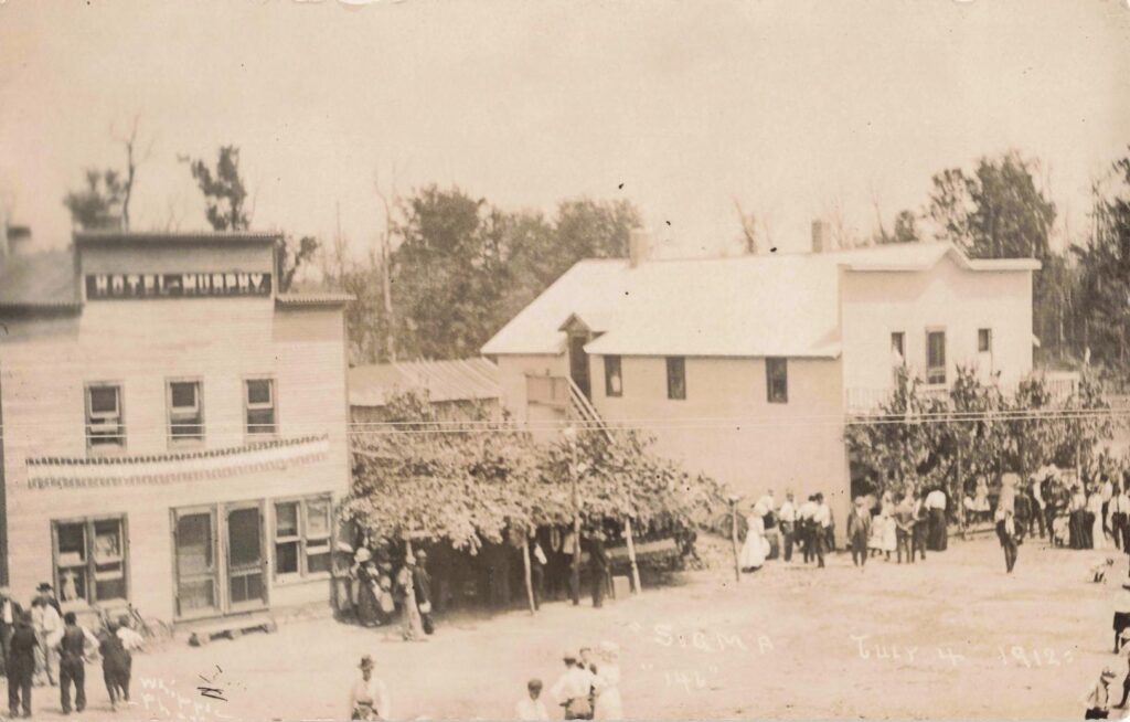  A July 4, 1912 street view shows Sigma as a busy public place, not just a camp in the woods.