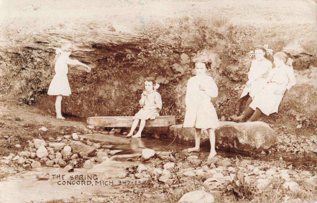 The Spring, Concord, Mich. — This image ties Concord’s public memory to childhood, water and place.