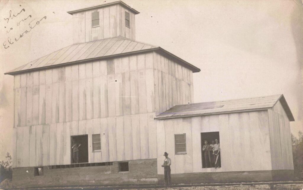 Hillman’s elevator buildings show the farm economy that helped support the village after the first timber rush slowed.