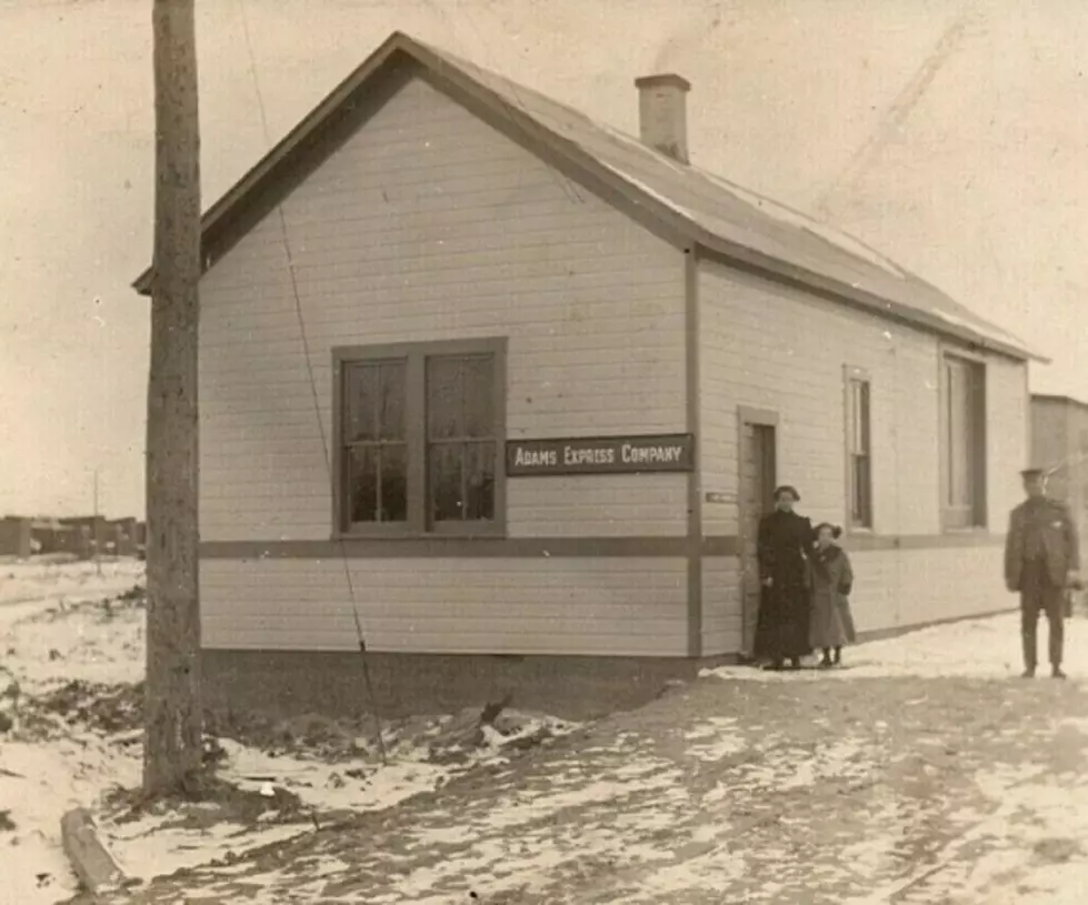 Falmouth depot with Adams Express sign.