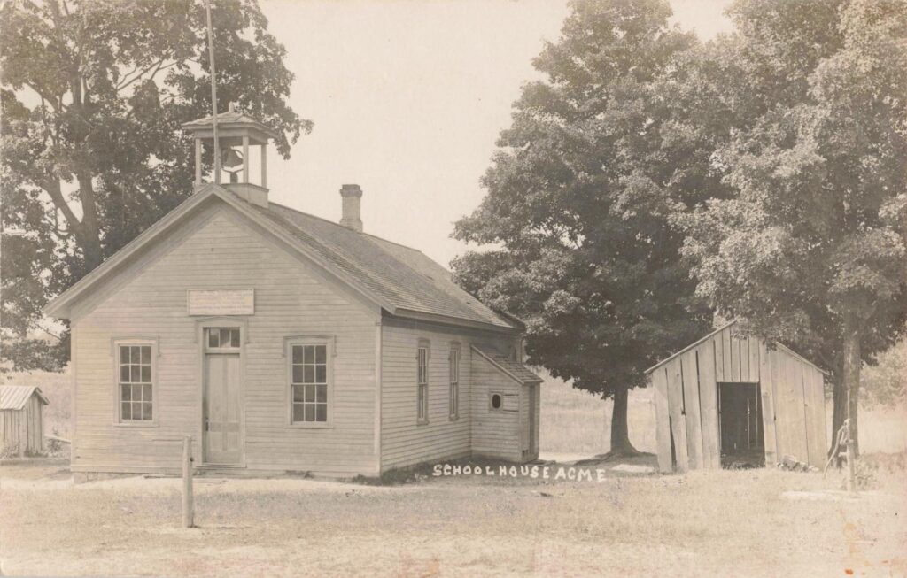 This rural Acme schoolhouse reflects the one-room school era, when education was close to farms and dirt roads.
