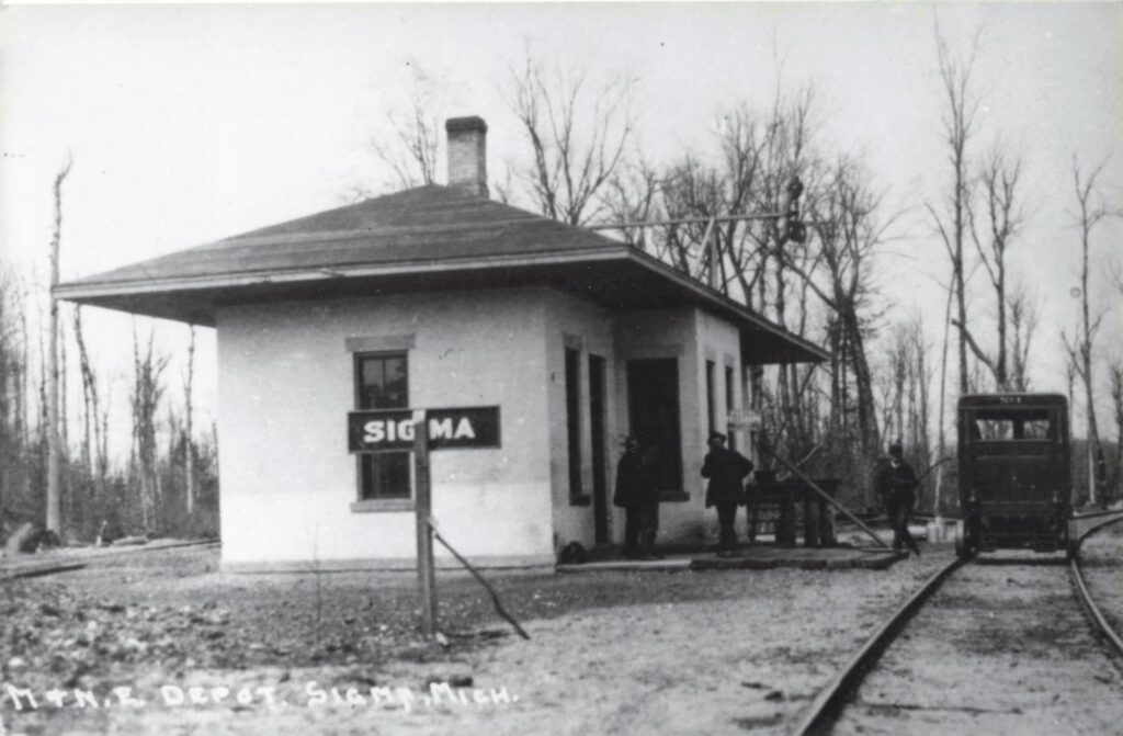 Sigma’s cinder-block depot was an unusual station type for Northern Michigan. - History of the Ghost Town of Sigma Michigan