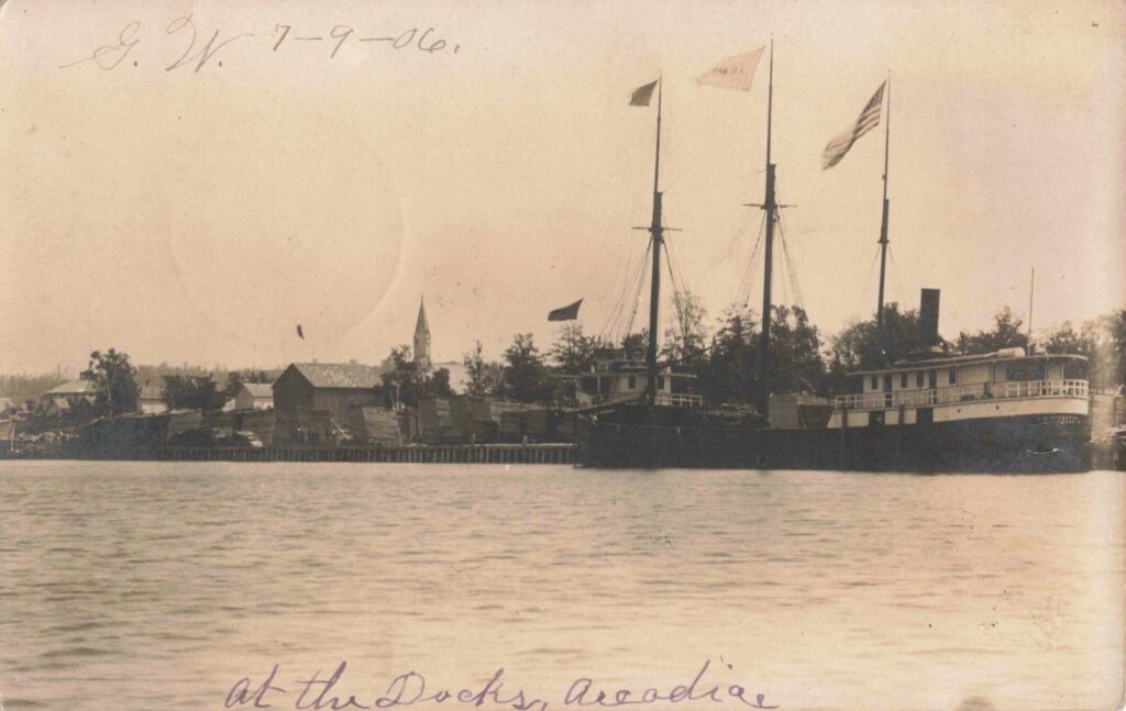 Dock scene dated by handwriting to July 1906. The timing is important because 1906 was the year the Starke sawmill burned and Arcadia’s industrial focus began shifting toward furniture.
