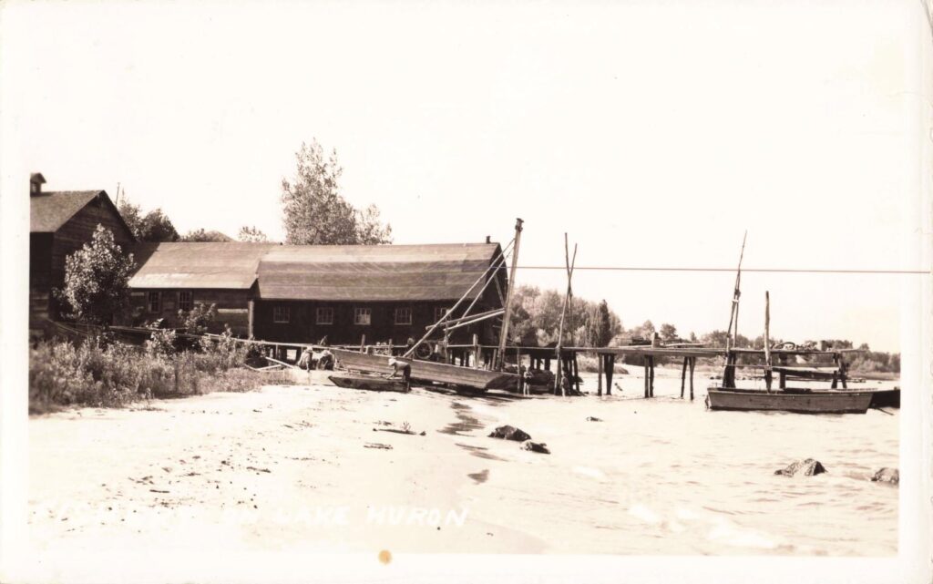 Old wooden buildings by the water.