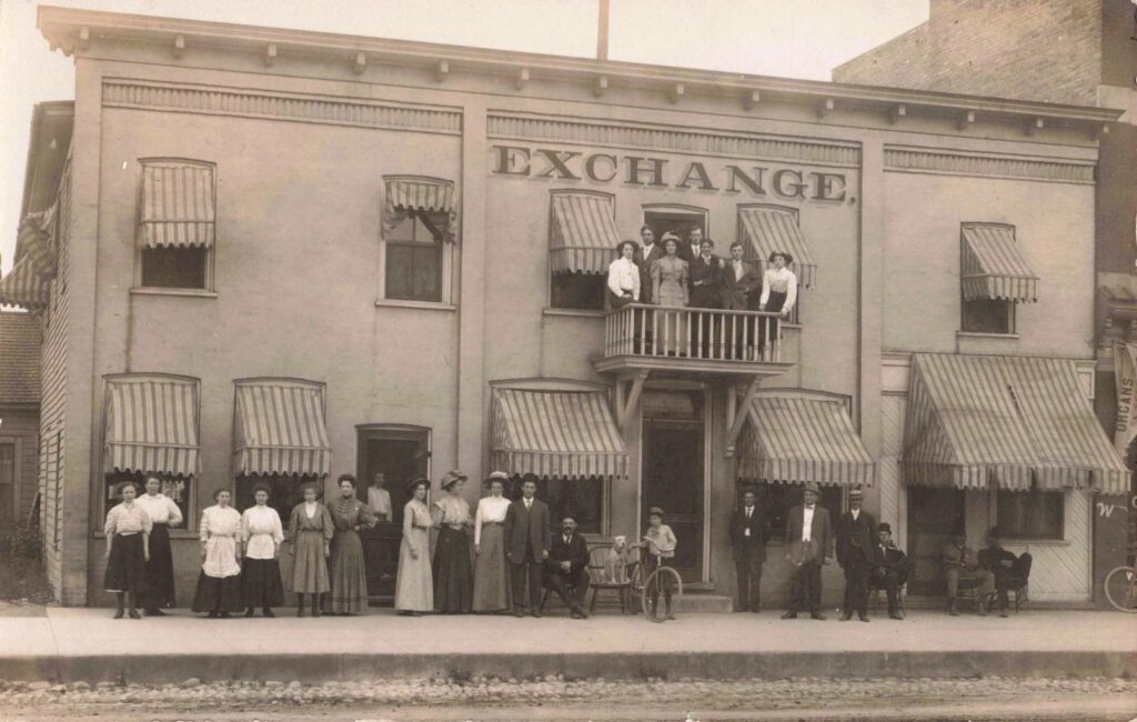 Historic Exchange building with people gathered outside.