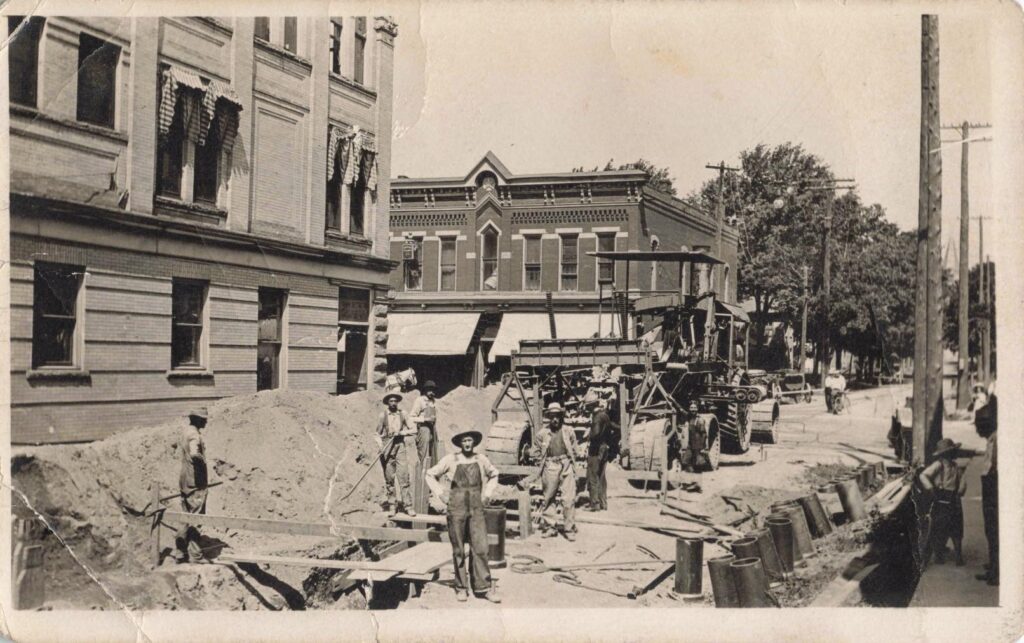 Historic street construction with workers