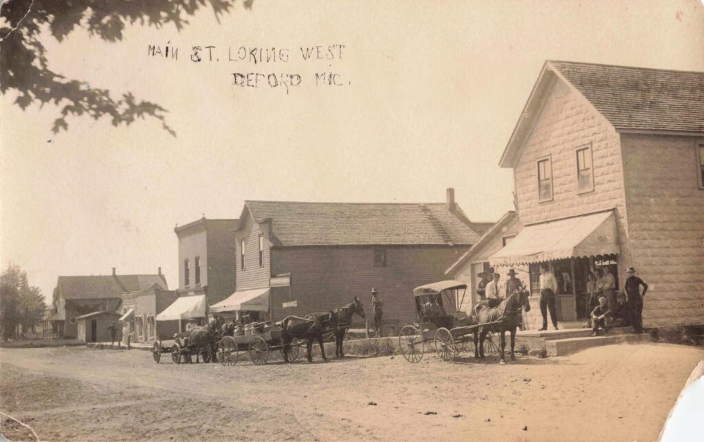 Horse-drawn wagons filled Main Street as residents shopped, conducted business, and waited for arriving trains.